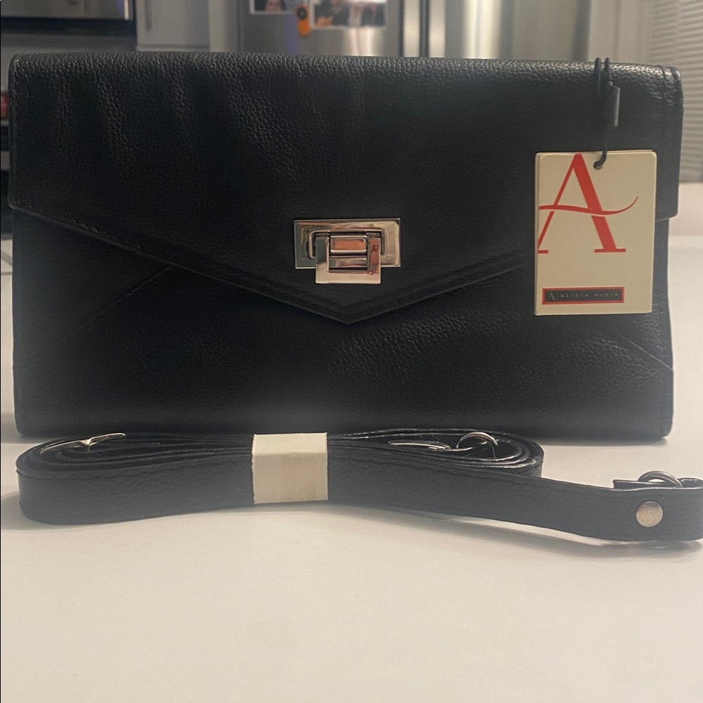 Alicia Klein handbag with strap included. NWT
